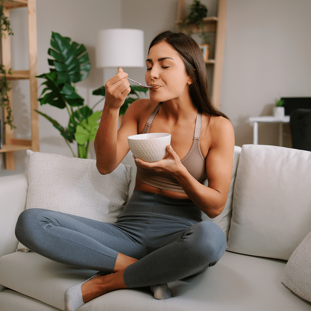 Woman enjoying food during oral immunotherapy for food allergies near Plano TX.